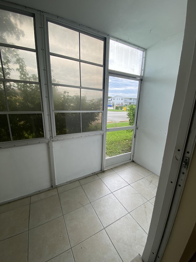 doorway to outside featuring light tile patterned floors