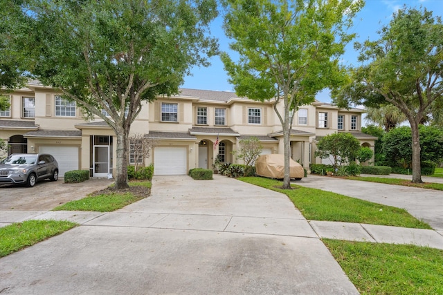 multi unit property featuring a garage