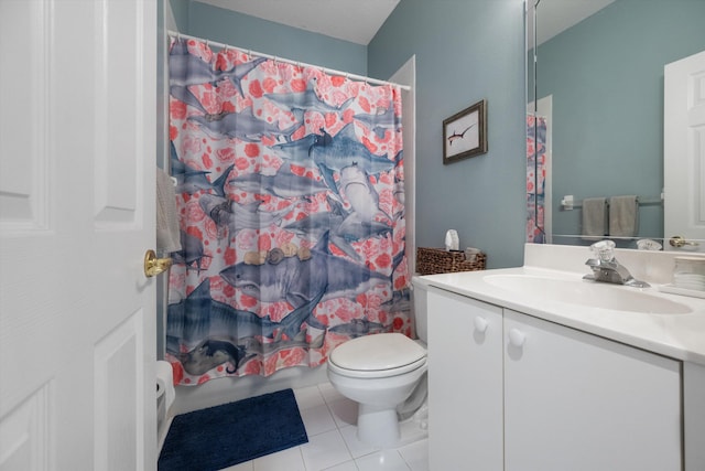 bathroom with tile patterned flooring, vanity, curtained shower, and toilet