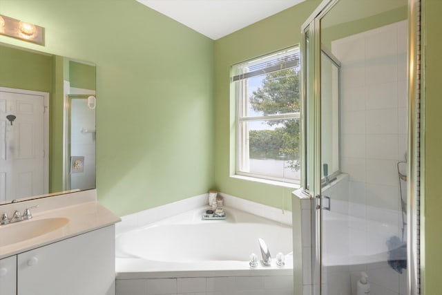 bathroom with vanity and independent shower and bath