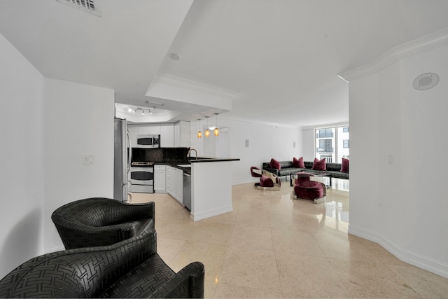 kitchen with appliances with stainless steel finishes, white cabinetry, backsplash, crown molding, and decorative light fixtures