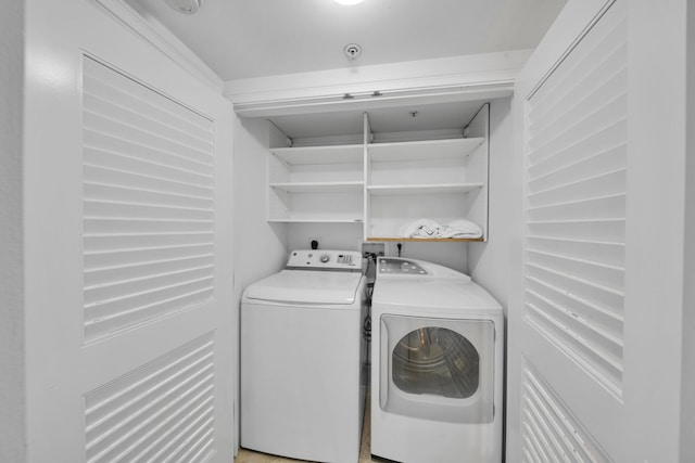 laundry room with washing machine and dryer