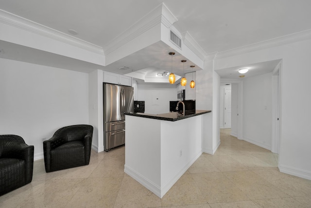 kitchen featuring stainless steel fridge, kitchen peninsula, ornamental molding, and white cabinetry