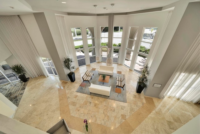 living room with a high ceiling and french doors