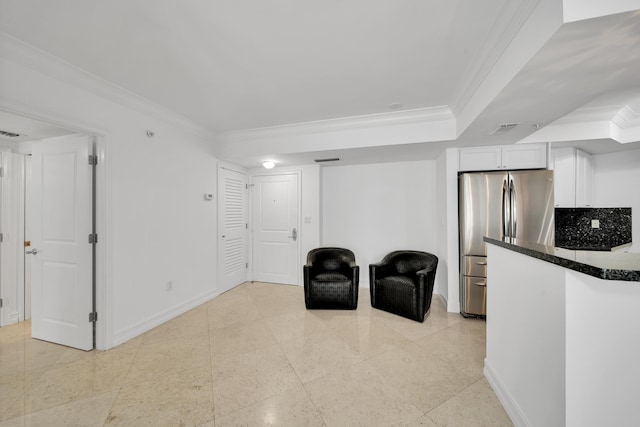 living area featuring ornamental molding