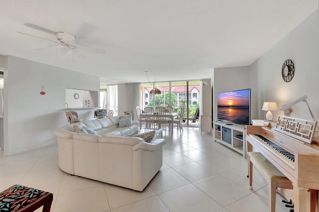 living room featuring light tile patterned floors, floor to ceiling windows, and ceiling fan