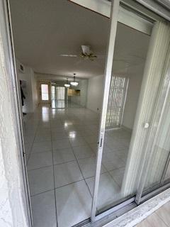 hallway featuring tile patterned flooring