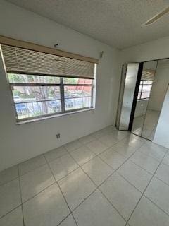 unfurnished bedroom with light tile patterned floors