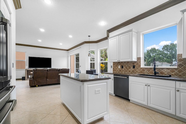 kitchen with light tile patterned floors, ornamental molding, sink, white cabinetry, and dishwasher