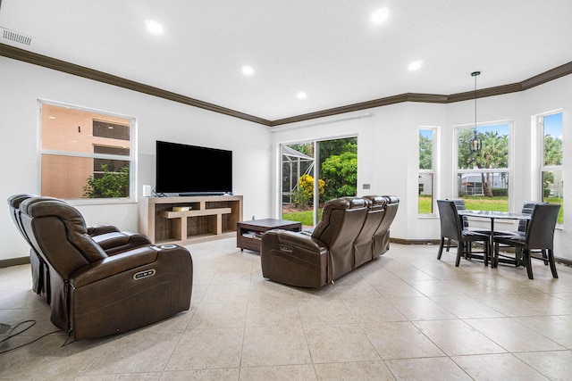 living room with light tile patterned flooring, crown molding, and a healthy amount of sunlight