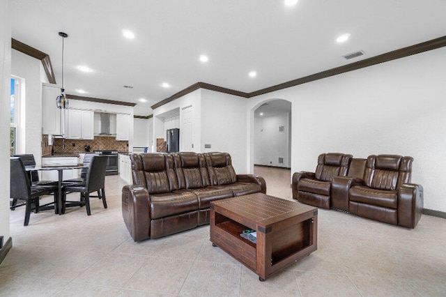 tiled living room with crown molding