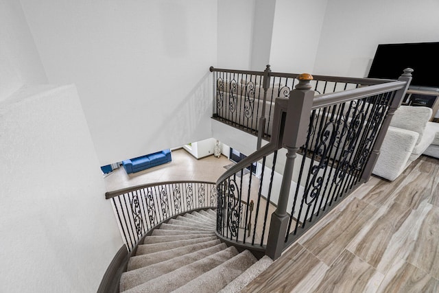 staircase featuring hardwood / wood-style flooring