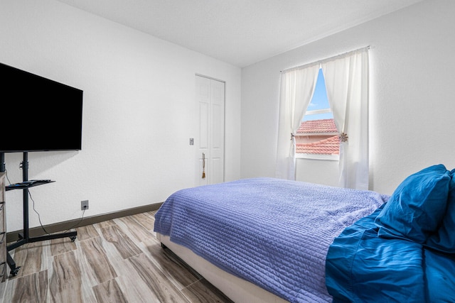 bedroom featuring hardwood / wood-style flooring