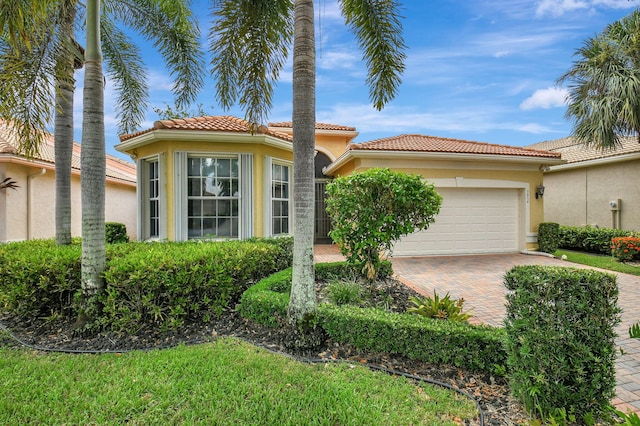 mediterranean / spanish-style house featuring a garage