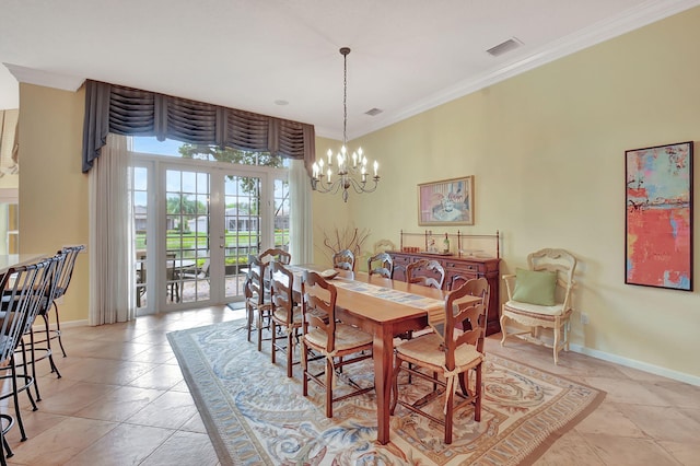 dining area featuring ornamental molding, a chandelier, and french doors