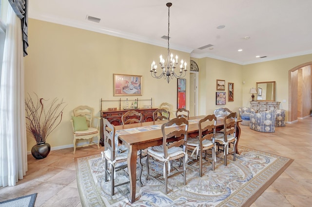 dining area with light tile patterned floors, a chandelier, and ornamental molding