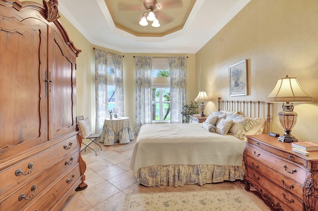 bedroom featuring ceiling fan, a raised ceiling, light tile patterned flooring, and crown molding