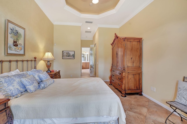 bedroom featuring ornamental molding and a tray ceiling