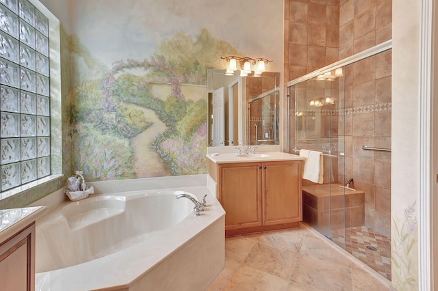 bathroom featuring vanity and separate shower and tub