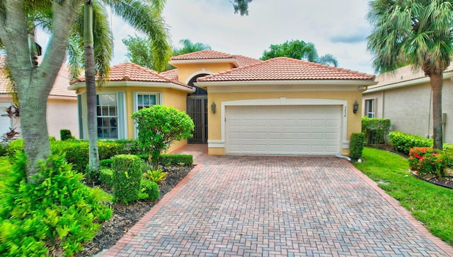 mediterranean / spanish-style home featuring a garage