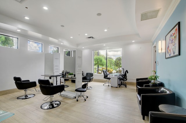 sitting room with crown molding, light hardwood / wood-style flooring, and a wealth of natural light