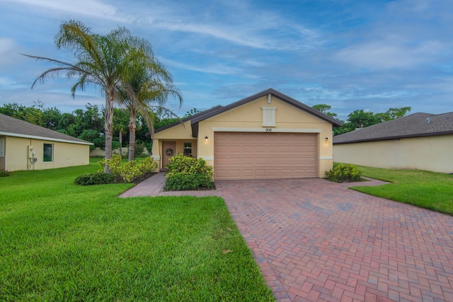 single story home featuring a front yard and a garage