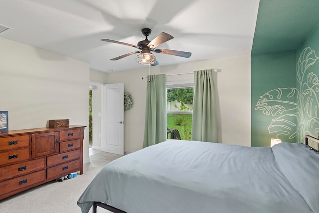 bedroom featuring light carpet and ceiling fan