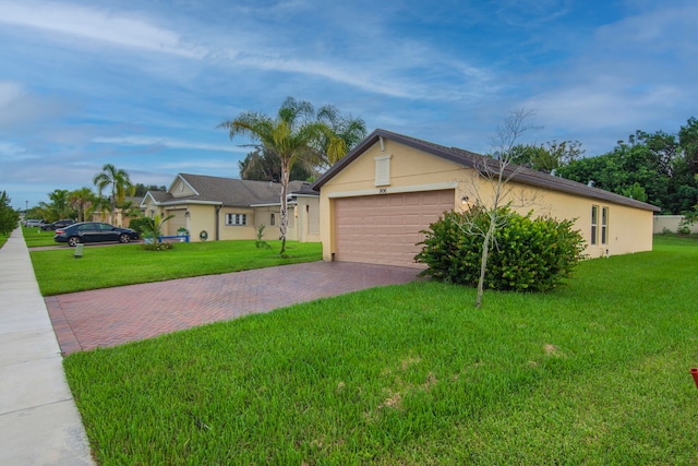 ranch-style home with a front lawn and a garage