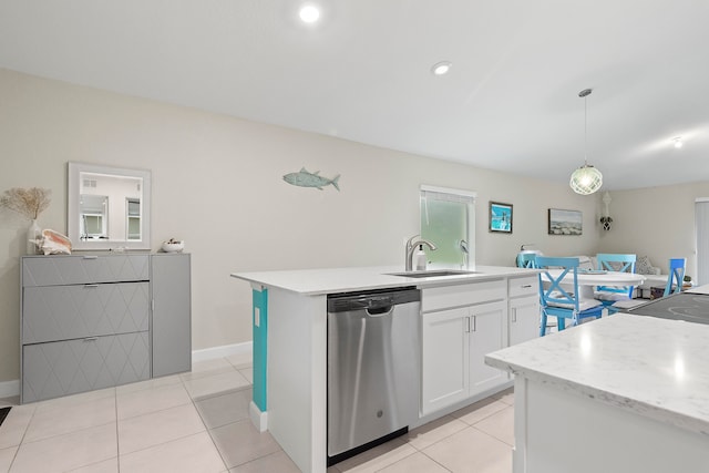 kitchen featuring white cabinets, hanging light fixtures, sink, stainless steel dishwasher, and a center island with sink