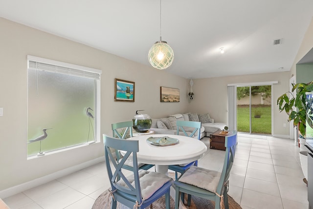 dining space featuring light tile patterned floors