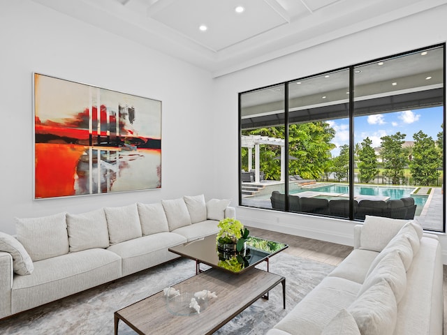 living room with hardwood / wood-style flooring and beamed ceiling