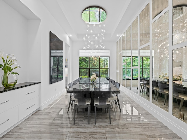 dining space with an inviting chandelier