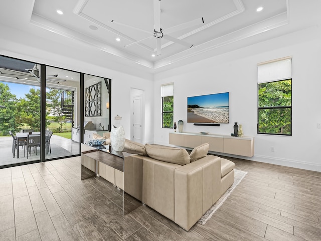 living room featuring a wealth of natural light, hardwood / wood-style floors, and ceiling fan