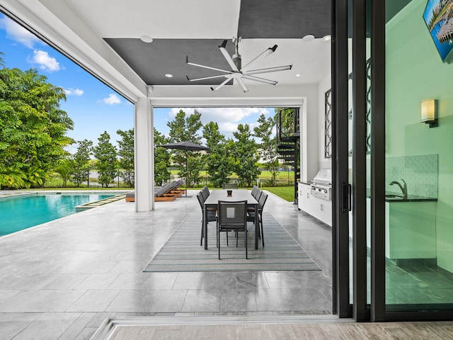 exterior space with a grill, a patio, and ceiling fan