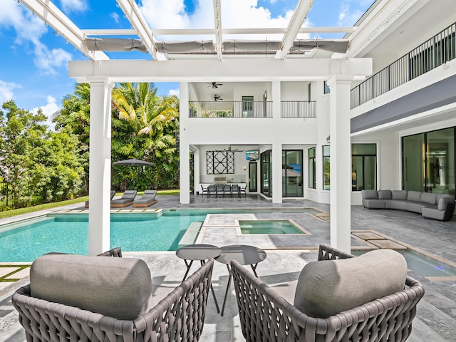 view of swimming pool with an outdoor living space and a patio area