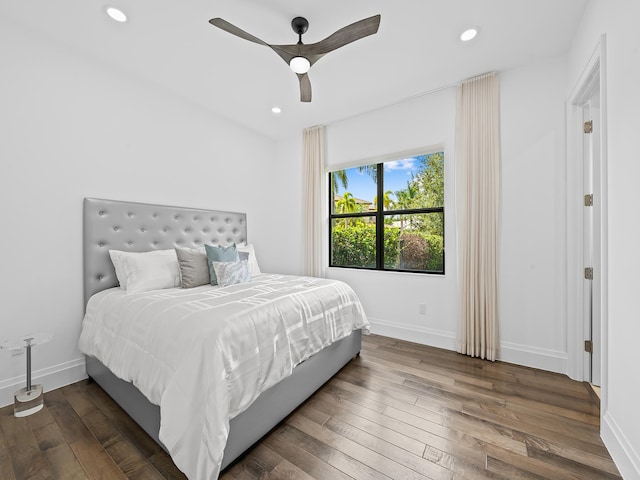 bedroom featuring dark wood-type flooring and ceiling fan