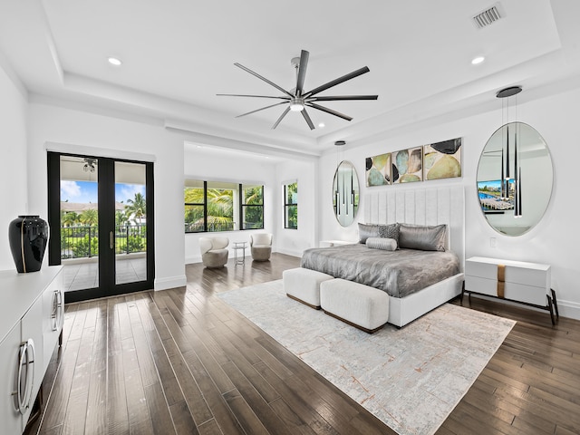 bedroom with access to outside, dark hardwood / wood-style floors, and ceiling fan