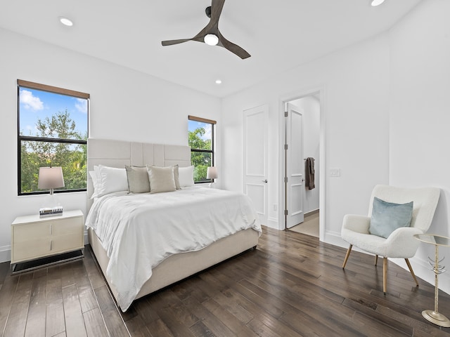 bedroom with ceiling fan and dark hardwood / wood-style floors