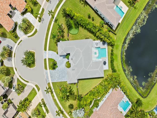 birds eye view of property with a water view