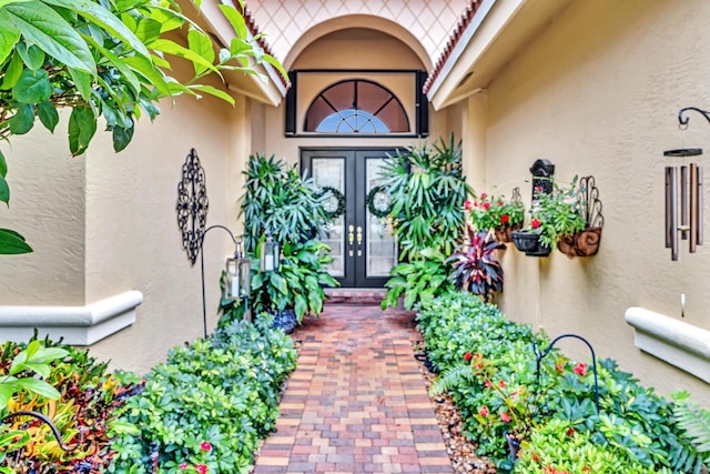 view of exterior entry featuring french doors