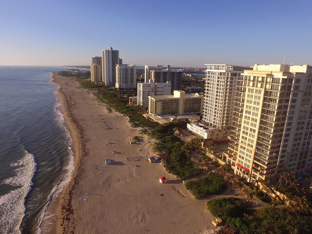 view of city featuring a water view and a beach view