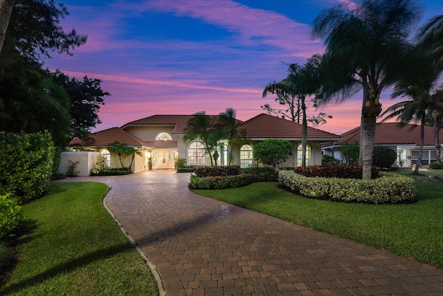 view of front of house with a lawn