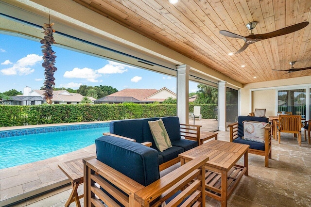 view of pool featuring ceiling fan, a patio area, and an outdoor hangout area