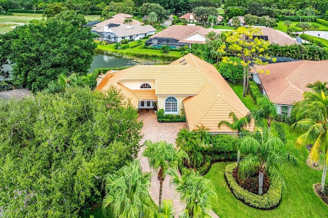 birds eye view of property with a water view