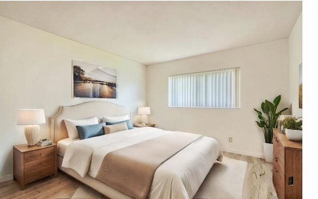 bedroom with light hardwood / wood-style floors