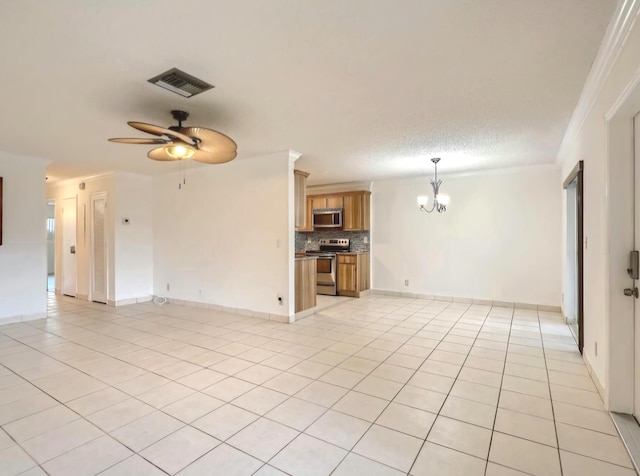 unfurnished living room featuring a textured ceiling, light tile patterned flooring, ceiling fan with notable chandelier, and ornamental molding