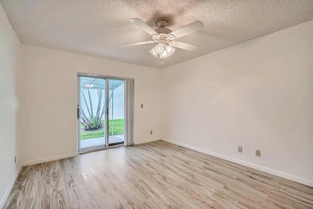 unfurnished room featuring ceiling fan, light hardwood / wood-style flooring, and a textured ceiling