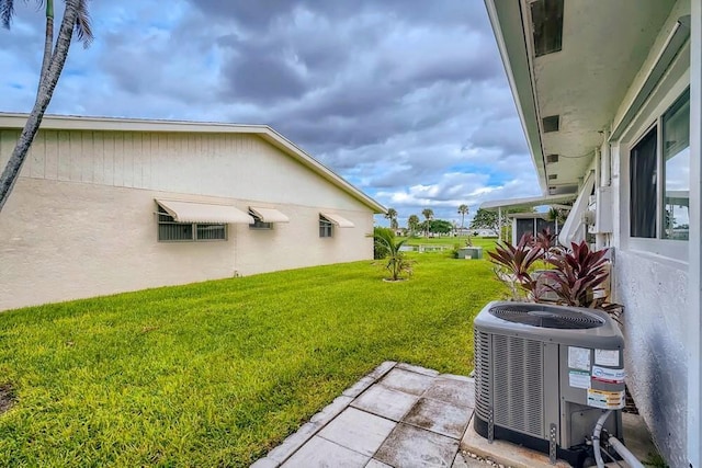 view of yard with central AC