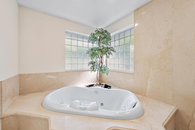 bathroom featuring a relaxing tiled tub