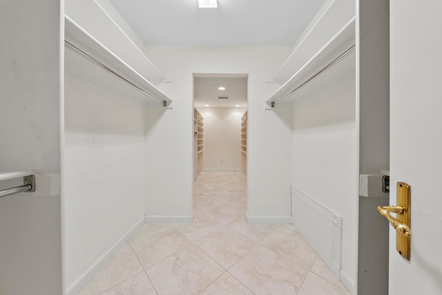 walk in closet featuring light tile patterned floors